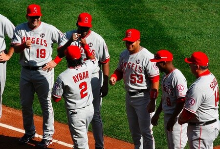 BOSTON - OCTOBER 11:  Erick Aybar #2 of the Los Angeles Angels of Anaheim is introduced during player introductions before taking on the Boston Red Sox in Game Three of the ALDS during the 2009 MLB Playoffs at Fenway Park on October 11, 2009 in Boston, Massachusetts. <br /><br /><span class="help">(Photo by Jim Rogash/Getty Images)</span>