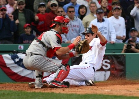 BOSTON - OCTOBER 11:  Jacoby Ellsbury #46 of the Boston Red Sox slides safely into home past catcher Mike Napoli #46 of the Los Angeles Angels of Anaheim to score on a Dustin Pedroia #15 double in the third inning of Game Three of the ALDS during the 2009 MLB Playoffs at Fenway Park on October 11, 2009 in Boston,  Massachusetts. <br /><br /><span class="help">(Photo by Jim Rogash/Getty Images)</span>