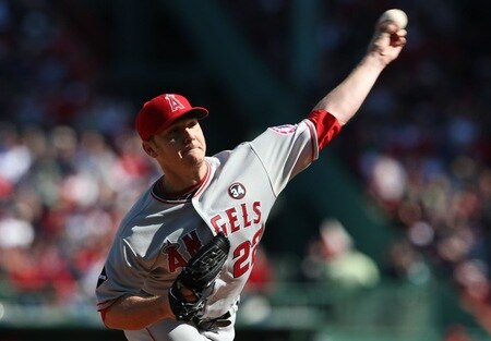 BOSTON - OCTOBER 11: Starting pitcher Scott Kazmir #22 of the Los Angeles Angels of Anaheim delivers a pitch against the Boston Red Sox in the first inning of Game Three of the ALDS during the 2009 MLB Playoffs at Fenway Park on October 11, 2009 in Boston, Massachusetts.  <br /><br /><span class="help">(Photo by Elsa/Getty Images)</span>