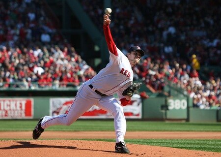 BOSTON - OCTOBER 11:  Starting pitcher Clay Buchholz #61 of the Boston Red Sox delivers a pitch against the Los Angeles Angels of Anaheim in the first inning in Game Three of the ALDS during the 2009 MLB Playoffs at Fenway Park on October 11, 2009 in Boston, Massachusetts. <br /><br /><span class="help">(Photo by Elsa/Getty Images)</span>