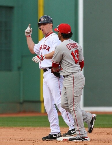 BOSTON - OCTOBER 11:  J.D. Drew #7 of the Boston Red Sox gestures that he hit a home run in the fourth inning as Maicer Izturis #13 of the Los Angeles Angels of Anaheim applies the tag in at second base in Game Three of the ALDS during the 2009 MLB Playoffs at Fenway Park on October 11, 2009 in Boston,  Massachusetts. The ruling on the field was the ball hit by Drew was a two-run home run. <br /><br /><span class="help">(Photo by Jim Rogash/Getty Images)</span>