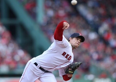 BOSTON - OCTOBER 11: Starting pitcher Clay Buchholz #61 of the Boston Red Sox delivers a pitch against the Los Angeles Angels of Anaheim in Game Three of the ALDS during the 2009 MLB Playoffs at Fenway Park on October 11, 2009 in Boston, Massachusetts. <br /><br /><span class="help">(Photo by Elsa/Getty Images)</span>