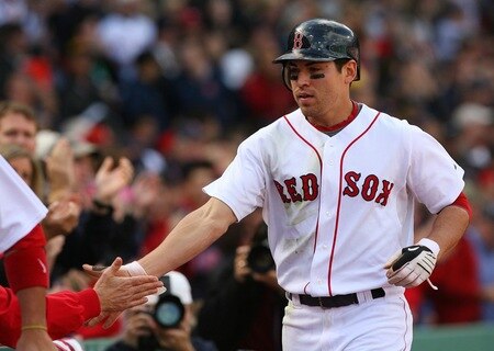 BOSTON - OCTOBER 11:  Jacoby Ellsbury #46 of the Boston Red Sox celebrates with teammates after scoring a run in the third inning against the Los Angeles Angels of Anaheim on a Dustin Pedroia #15 double in the third inning of Game Three of the ALDS during the 2009 MLB Playoffs at Fenway Park on October 11, 2009 in Boston,  Massachusetts. <br /><br /><span class="help">(Photo by Jim Rogash/Getty Images)</span>