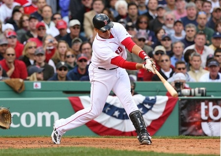 BOSTON - OCTOBER 11:  Victor Martinez #41 of the Boston Red Sox hits a RBI single in the third inning against the Los Angeles Angels of Anaheim in Game Three of the ALDS during the 2009 MLB Playoffs at Fenway Park on October 11, 2009 in Boston,  Massachusetts. <br /><br /><span class="help">(Photo by Jim Rogash/Getty Images)</span>