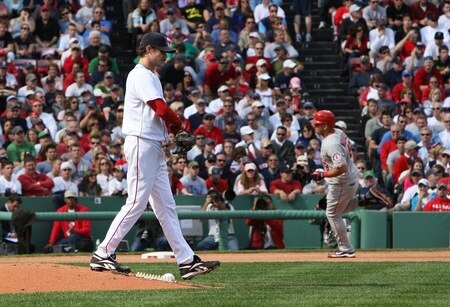 BOSTON - OCTOBER 11:  Kendry Morales #19 of the Los Angeles Angels of Anaheim rounds the bases after hitting a fourth inning home run as pitcher Clay Buchholz #61 of the Boston Red Sox looks on in Game Three of the ALDS during the 2009 MLB Playoffs at Fenway Park on October 11, 2009 in Boston,  Massachusetts. <br /><br /><span class="help">(Photo by Jim Rogash/Getty Images)</span>