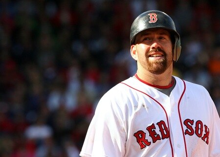 BOSTON - OCTOBER 11:  Kevin Youkilis #20 of the Boston Red Sox smiles after flying out to center field in the fifth inning against the Los Angeles Angels of Anaheim in Game Three of the ALDS during the 2009 MLB Playoffs at Fenway Park on October 11, 2009 in Boston,  Massachusetts. <br /><br /><span class="help">(Photo by Jim Rogash/Getty Images)</span>