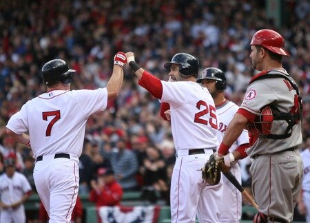BOSTON - OCTOBER 11:  J.D. Drew #7 of the Boston Red Sox celebrates at home plate with Mike Lowell #25 after hitting a two run home run to score Lowell in the fourth inning of Game Three of the ALDS against the Los Angeles Angels of Anaheim during the 2009 MLB Playoffs at Fenway Park on October 11, 2009 in Boston, Massachusetts. <br /><br /><span class="help">(Photo by Elsa/Getty Images)</span>