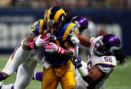 ST. LOUIS - OCTOBER 11:  Running back Steven Jackson #39 of the St. Louis Rams is tackled by Cedric Griffin #23 and E.J. Henderson #56 of the Minnesota Vikings at Edward Jones Dome on October 11, 2009 in St. Louis, Missouri.  <br /><br /><span class="help">(Photo by Ronald Martinez/Getty Images)</span>