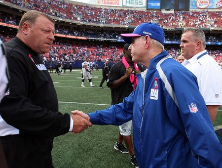 EAST RUTHERFORD, NJ - OCTOBER 11:  Head coach Tom Coughlin of the New York Giants shakes hands with head coach Tom Cable of the Oakland Raiders after their game on October 11, 2009 at Giants Stadium in East Rutherford, New Jersey. The Giants defeated the Raiders 44-7.  <br /><br /><span class="help">(Photo by Jim McIsaac/Getty Images)</span>
