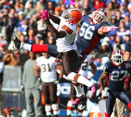 ORCHARD PARK, NY - OCTOBER 11: Mohammed Massaquoi #11 of the Cleveland Browns and Keith Ellison #56 of the Buffalo Bills try to make a play at Ralph Wilson Stadium on October 11, 2009 in Orchard Park, New York.  <br /><br /><span class="help">(Photo by Rick Stewart/Getty Images)</span>