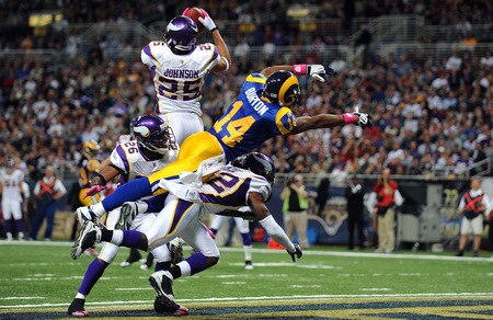 ST. LOUIS - OCTOBER 11:  Safety Tyrell Johnson #25 of the Minnesota Vikings makes a pass interception inteded for Keenan Burton #14 of the St. Louis Rams at Edward Jones Dome on October 11, 2009 in St. Louis, Missouri.  <br /><br /><span class="help">(Photo by Ronald Martinez/Getty Images)</span>