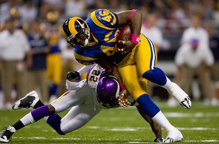 ST. LOUIS, MO - OCTOBER 11: Daniel Fells #46 of the St. Louis Rams is tackled by Benny Sapp #22 of the Minnesota Vikings at the Edward Jones Dome on October 11, 2009 in St. Louis, Missouri.  <br /><br /><span class="help">(Photo by Dilip Vishwanat/Getty Images)</span>