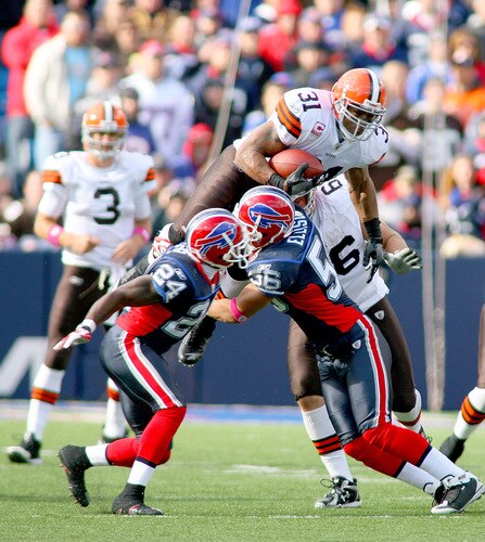 ORCHARD PARK, NY - OCTOBER 11:  Jamal Lewis #31 of the Cleveland Browns tries to jump over Keith Ellison #56 of the Buffalo Bills at Ralph Wilson Stadium on October 11, 2009 in Orchard Park, New York. Cleveland won 6-3.  <br /><br /><span class="help">(Photo by Rick Stewart/Getty Images)</span>