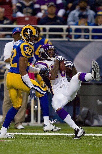 ST. LOUIS, MO - OCTOBER 11: Sidney Rice #18 of the Minnesota Vikings hauls in a pass against Bradley Fletcher #32 of the St. Louis Rams at the Edward Jones Dome on October 11, 2009 in St. Louis, Missouri.  The Vikings beat the Rams 38-10.  <br /><br /><span class="help">(Photo by Dilip Vishwanat/Getty Images)</span>