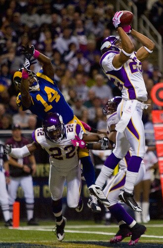ST. LOUIS, MO - OCTOBER 11: Tyrell Johnson #25 of the Minnesota Vikings intercepts a pass intended for Keenan Burton #14 of the St. Louis Rams at the Edward Jones Dome on October 11, 2009 in St. Louis, Missouri.  The Vikings beat the Rams 38-10.  <br /><br /><span class="help">(Photo by Dilip Vishwanat/Getty Images)</span>