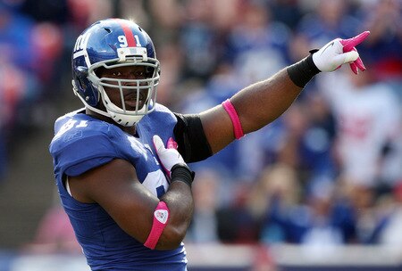 EAST RUTHERFORD, NJ - OCTOBER 11:  Justin Tuck #91 of the New York Giants celebrates his sack in the third quarter against the Oakland Raiders on October 11, 2009 at Giants Stadium in East Rutherford, New Jersey. The Giants defeated the Raiders 44-7.  <br /><br /><span class="help">(Photo by Jim McIsaac/Getty Images)</span>