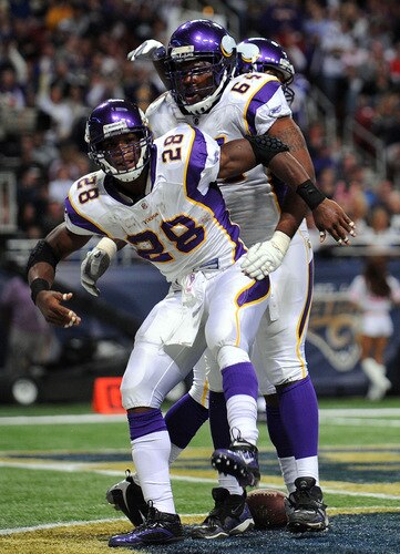 ST. LOUIS - OCTOBER 11:  Running back Adrian Peterson #28 of the Minnesota Vikings celebrates his touchdown with Anthony Herrera #64 against the St. Louis Rams at Edward Jones Dome on October 11, 2009 in St. Louis, Missouri.  <br /><br /><span class="help">(Photo by Ronald Martinez/Getty Images)</span>