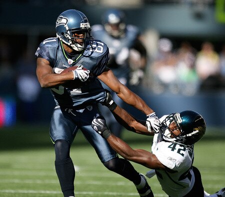 SEATTLE - OCTOBER 11:  Wide receiver Nate Burleson #81 of the Seattle Seahawks breaks away from Gerald Alexander #42 of the Jacksonville Jaguars for a touchdown in the first half on October 11, 2009 at Qwest Field in Seattle, Washington. <br /><br /><span class="help">(Photo by Otto Greule Jr/Getty Images)</span>