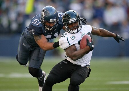 SEATTLE - OCTOBER 11:  Running back Maurice Jones-Drew #32 of the Jacksonville Jaguars is tackled by Lofa Tatupu #51 of the Seattle Seahawks on October 11, 2009 at Qwest Field in Seattle, Washington. The Seahawks defeated the Jaguars 41-0. <br /><br /><span class="help">(Photo by Otto Greule Jr/Getty Images)</span>