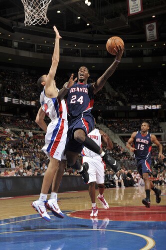 AUBURN HILLS, MI - OCTOBER 11:  Marvin Williams #24 of the Atlanta Hawks drives around Tayshaun Prince  #22 of the Detroit Pistonsin a preseason game at the Palace of Auburn Hills on October 11, 2009 in Auburn Hills, Michigan.  <br /><br /><span class="help">(Photo by Allen Einstein/NBAE via Getty Images)</span>