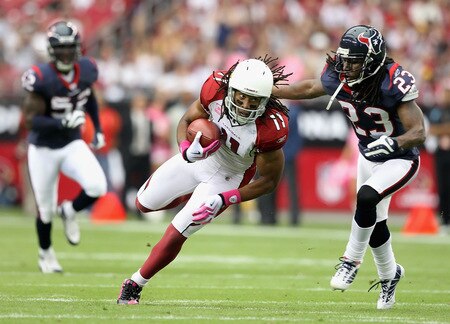 GLENDALE, AZ - OCTOBER 11:  Wide receiver Larry Fitzgerald #11 of the Arizona Cardinals runs with the ball after a reception past Dunta Robinson #23 of the Houston Texans during the NFL game at the Universtity of Phoenix Stadium on October 11, 2009 in Glendale, Arizona.  <br /><br /><span class="help">(Photo by Christian Petersen/Getty Images)</span>
