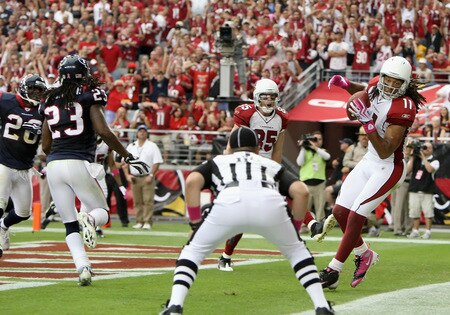 GLENDALE, AZ - OCTOBER 11:  Wide receiver Larry Fitzgerald #11 of the Arizona Cardinals catches a 9 yard touchdown reception against the Houston Texans during the secnd quarter of the NFL game at the Universtity of Phoenix Stadium on October 11, 2009 in Glendale, Arizona.  <br /><br /><span class="help">(Photo by Christian Petersen/Getty Images)</span>