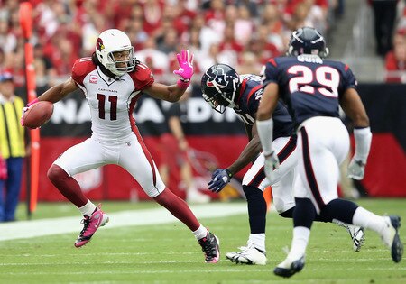 GLENDALE, AZ - OCTOBER 11:  Wide receiver Larry Fitzgerald #11 of the Arizona Cardinals runs with the ball after a reception past Bernard Pollard #31 of the Houston Texans during the NFL game at the Universtity of Phoenix Stadium on October 11, 2009 in Glendale, Arizona.  <br /><br /><span class="help">(Photo by Christian Petersen/Getty Images)</span>