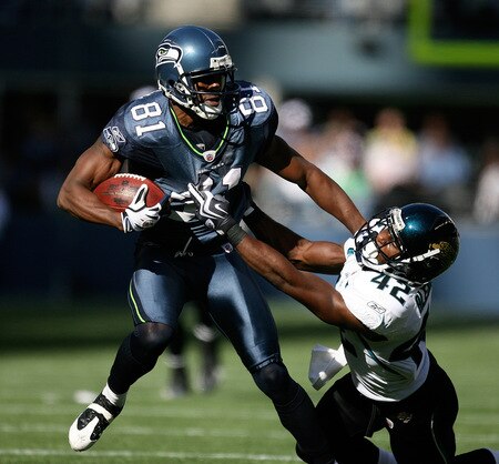SEATTLE - OCTOBER 11:  Wide receiver Nate Burleson #81 of the Seattle Seahawks breaks away from Gerald Alexander #42 of the Jacksonville Jaguars for a touchdown in the first half on October 11, 2009 at Qwest Field in Seattle, Washington. The Seahawks defeated the Jaguars 41-0. <br /><br /><span class="help">(Photo by Otto Greule Jr/Getty Images)</span>