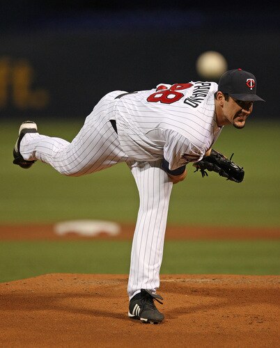MINNEAPOLIS - OCTOBER 11: Carl Pavano #48 of the Minnesota Twins delivers the ball against the New York Yankees in Game Three of the ALDS during the 2009 MLB Playoffs at the Hubert H. Humphrey Metrodome on October 11, 2009 in Minneapolis, Minnesota. <br /><br /><span class="help">(Photo by Jonathan Daniel/Getty Images)</span>