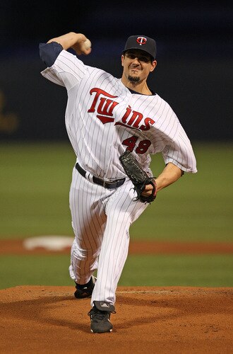 MINNEAPOLIS - OCTOBER 11: Carl Pavano #48 of the Minnesota Twins delivers the ball against the New York Yankees in Game Three of the ALDS during the 2009 MLB Playoffs at the Hubert H. Humphrey Metrodome on October 11, 2009 in Minneapolis, Minnesota. <br /><br /><span class="help">(Photo by Jonathan Daniel/Getty Images)</span>