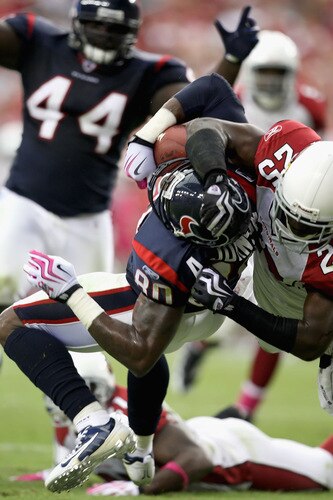 GLENDALE, AZ - OCTOBER 11: Wide receiver Andre Johnson #80 of the Houston Texans catches a 17 yard touchdown reception under pressure from Bryant McFadden #25 of the Arizona Cardinals during the fourth quarter of the NFL game at the Universtity of Phoenix Stadium on October 11, 2009 in Glendale, Arizona. <br /><br /><span class="help">(Photo by Christian Petersen/Getty Images)</span>