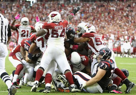 GLENDALE, AZ - OCTOBER 11: Linebacker Gerald Hayes #54 of the Arizona Cardinals signals for a turnover after the Houston Texans were stopped on a fourth and goal during the final moments of the NFL game at the Universtity of Phoenix Stadium on October 11, 2009 in Glendale, Arizona. <br /><br /><span class="help">(Photo by Christian Petersen/Getty Images)</span>