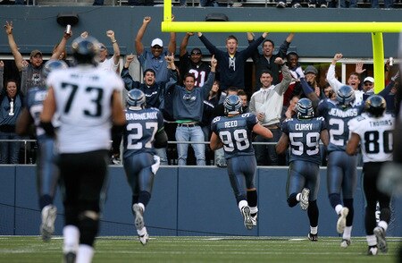 SEATTLE - OCTOBER 11:  Defensive end Nick Reed #98 of the Seattle Seahawks returns a fumble for a touchdown against the Jacksonville Jaguars on October 11, 2009 at Qwest Field in Seattle, Washington. The Seahawks defeated the Jaguars 41-0. <br /><br /><span class="help">(Photo by Otto Greule Jr/Getty Images)</span>