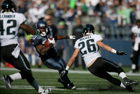 SEATTLE - OCTOBER 11:  Running back Justin Forsett #20 of the Seattle Seahawks rushes against Brian Russell #26 of the Jacksonville Jaguars on October 11, 2009 at Qwest Field in Seattle, Washington. The Seahawks defeated the Jaguars 41-0. <br /><br /><span class="help">(Photo by Otto Greule Jr/Getty Images)</span>