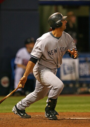 MINNEAPOLIS - OCTOBER 11: Jorge Posada #20 of the New York Yankees follows the flight of his solo home run in the 7th inning against the Minnesota Twins in Game Three of the ALDS during the 2009 MLB Playoffs at the Hubert H. Humphrey Metrodome on October 11, 2009 in Minneapolis, Minnesota. <br /><br /><span class="help">(Photo by Jonathan Daniel/Getty Images)</span>