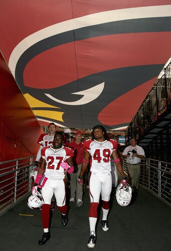 GLENDALE, AZ - OCTOBER 11: (L-R) Kurt Warner #13, Michael Adams #27 and Rashad Johnson #49 of the Arizona Cardinals walk off the field following warm ups to the NFL game against the Houston Texans at the Universtity of Phoenix Stadium on October 11, 2009 in Glendale, Arizona. <br /><br /><span class="help">(Photo by Christian Petersen/Getty Images)</span>