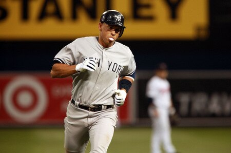 MINNEAPOLIS, MN - OCTOBER 11: Alex Rodriguez #13 of the New York Yankees blows a bubble while rounding third base after hitting a home run in the seventh inning in Game Three of the ALDS during the 2009 MLB Playoffs at the Hubert H. Humphrey Metrodome on October 11, 2009 in Minneapolis, Minnesota. <br /><br /><span class="help">(Photo by Genevieve Ross/Getty Images)</span>