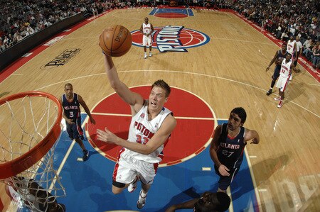 AUBURN HILLS, MI - OCTOBER 11:  Jonas Jerebko #33 of the Detroit Pistons drives around Juan Dixon #3 and Zaza Pachulia #27 of the Atlanta Hawks in a preseason game at the Palace of Auburn Hills on October 11, 2009 in Auburn Hills, Michigan.  <br /><br /><span class="help">(Photo by Allen Einstein/NBAE via Getty Images)</span>