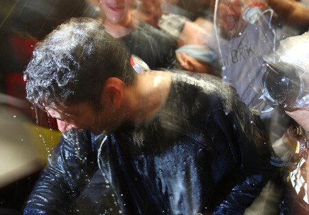 MINNEAPOLIS - OCTOBER 11: Jorge Posada of the New York Yankees gets doused with champagne and beer after a win over the Minnesota Twins in Game Three of the ALDS during the 2009 MLB Playoffs at the Hubert H. Humphrey Metrodome on October 11, 2009 in Minneapolis, Minnesota. <br /><br /><span class="help">(Photo by Jonathan Daniel/Getty Images)</span>
