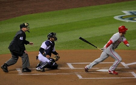 DENVER - OCTOBER 11:  Chase Utley #26 of the Philadelphia Phillies hits a home run against the Colorado Rockies in the first inning in Game Three of the NLDS during the 2009 MLB Playoffs at Coors Field on October 11, 2009 in Denver, Colorado. <br /><br /><span class="help">(Photo by Jed Jacobsohn/Getty Images)</span>