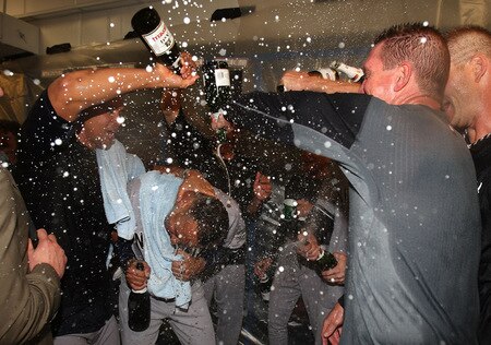 MINNEAPOLIS - OCTOBER 11: Alex Rodriguez (center) of the New York Yankees gets doused with champagne and beer after a win over the Minnesota Twins in Game Three of the ALDS during the 2009 MLB Playoffs at the Hubert H. Humphrey Metrodome on October 11, 2009 in Minneapolis, Minnesota. <br /><br /><span class="help">(Photo by Jonathan Daniel/Getty Images)</span>