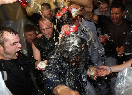 MINNEAPOLIS - OCTOBER 11: Jorge Posada of the New York Yankees gets doused with champagne and beer after a win over the Minnesota Twins in Game Three of the ALDS during the 2009 MLB Playoffs at the Hubert H. Humphrey Metrodome on October 11, 2009 in Minneapolis, Minnesota. <br /><br /><span class="help">(Photo by Jonathan Daniel/Getty Images)</span>