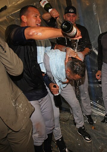 MINNEAPOLIS - OCTOBER 11: Alex Rodriguez (L) and Alfredo Aceves (R) of the New York Yankees douse teammate Derek Jeter with champagne after a win over the Minnesota Twins in Game Three of the ALDS during the 2009 MLB Playoffs at the Hubert H. Humphrey Metrodome on October 11, 2009 in Minneapolis, Minnesota. <br /><br /><span class="help">(Photo by Jonathan Daniel/Getty Images)</span>