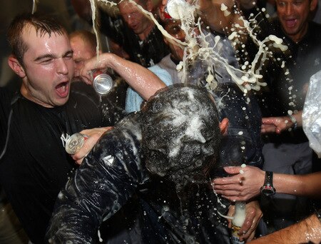 MINNEAPOLIS - OCTOBER 11: Jorge Posada of the New York Yankees gets doused with champagne and beer after a win over the Minnesota Twins in Game Three of the ALDS during the 2009 MLB Playoffs at the Hubert H. Humphrey Metrodome on October 11, 2009 in Minneapolis, Minnesota. <br /><br /><span class="help">(Photo by Jonathan Daniel/Getty Images)</span>