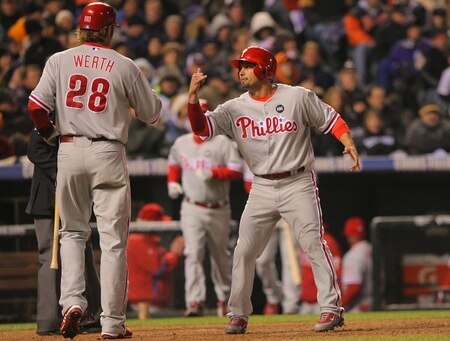 DENVER - OCTOBER 11:  Shane Victorino #8 of the Philadelphia Phillies gestures "hang loose" to teammate Jayson Werth #28 after Victorino scored in the top of the fourth inning against the Colorado Rockies in Game Three of the NLDS during the 2009 MLB Playoffs at Coors Field on October 11, 2009 in Denver, Colorado. <br /><br /><span class="help">(Photo by Doug Pensinger/Getty Images)</span>