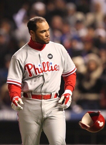 DENVER - OCTOBER 11:  Pedro Feliz #7 of the Philadelphia Phillies reacts after striking out to end the second inning against the Colorado Rockies in Game Three of the NLDS during the 2009 MLB Playoffs at Coors Field on October 11, 2009 in Denver, Colorado. <br /><br /><span class="help">(Photo by Jed Jacobsohn/Getty Images)</span>