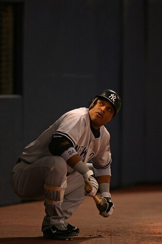 MINNEAPOLIS - OCTOBER 11: Robinson Cano #24 of the New York Yankees looks up at fans in the stands as he waits to bat against the Minnesota Twins in Game Three of the ALDS during the 2009 MLB Playoffs at the Hubert H. Humphrey Metrodome on October 11, 2009 in Minneapolis, Minnesota. <br /><br /><span class="help">(Photo by Jonathan Daniel/Getty Images)</span>
