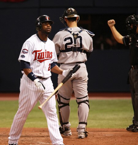 MINNEAPOLIS, MN - OCTOBER 11: Delmon Young #21 of the Minnesota Twins walks toward the dugout after being struck out in the ninth inning against the New York Yankees in Game Three of the ALDS during the 2009 MLB Playoffs at the Hubert H. Humphrey Metrodome on October 11, 2009 in Minneapolis, Minnesota. <br /><br /><span class="help">(Photo by Genevieve Ross/Getty Images)</span>