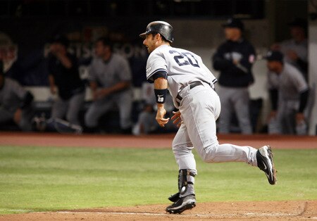 MINNEAPOLIS, MN - OCTOBER 11: Jorge Posada #20 of the New York Yankees watches his single RBI in the ninth inning in Game Three of the ALDS during the 2009 MLB Playoffs at the Hubert H. Humphrey Metrodome on October 11, 2009 in Minneapolis, Minnesota. The Yankees defeated the Twins 4-1. <br /><br /><span class="help">(Photo by Genevieve Ross/Getty Images)</span>