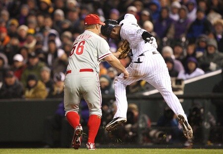 DENVER - OCTOBER 11:  Joe Blanton #56 of the Philadelphia Phillies tags out Dexter Fowler #24 of the Colorado Rockies for the third out in the bottom of the fourth inning in Game Three of the NLDS during the 2009 MLB Playoffs at Coors Field on October 11, 2009 in Denver, Colorado. <br /><br /><span class="help">(Photo by Jed Jacobsohn/Getty Images)</span>